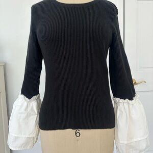 Maeve Black Ribbed Sweater with White Ruffle Sleeve Detail